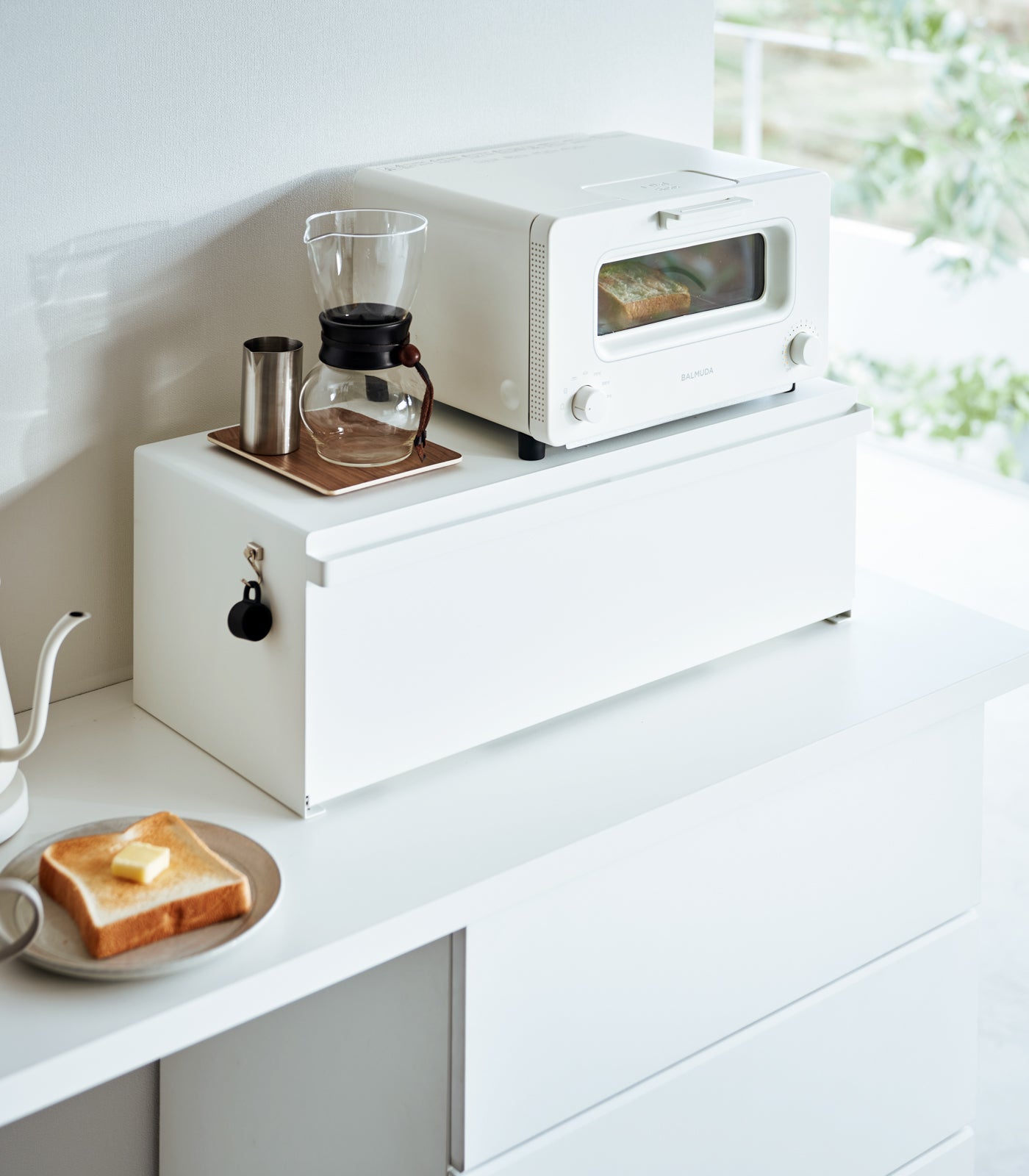White steel bread box shown open